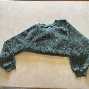 Green, fuzzy pull over